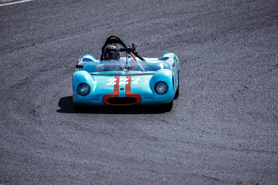 Person in sports car on road