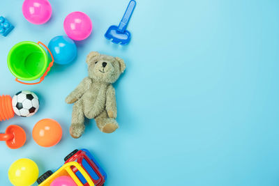 High angle view of toys on table against blue background