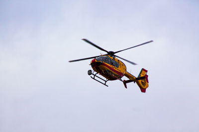 Low angle view of airplane flying in sky