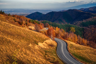 High angle view of road amidst mountains against sky