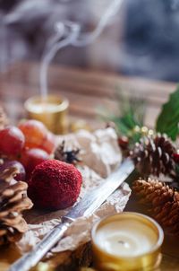 High angle view of food and pine cones on table