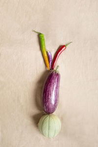 Fresh fruit and vegetables on beige background