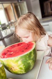 Little girl eating a watermelon