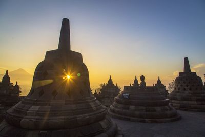 Temple against sky during sunset