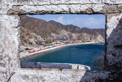 View of mountain by sea