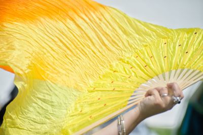 Close-up of woman hand holding umbrella