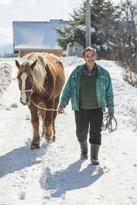 Portrait of man standing outdoors