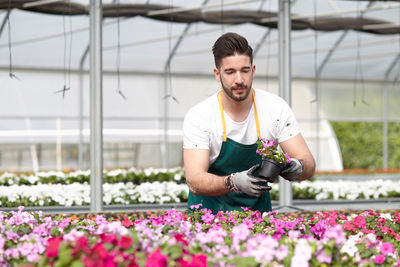 Full length of man working at flower