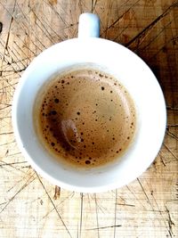 High angle view of coffee cup on table