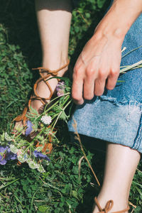 Low section of woman wearing shoes outdoors