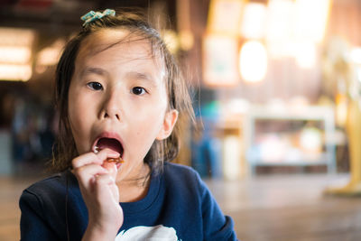 Portrait of cute boy eating