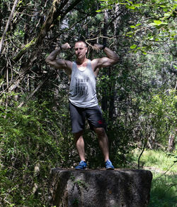 Full length of young man in forest