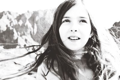 Close-up of girl looking away in sunny day