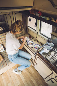 High angle view of woman sitting at home