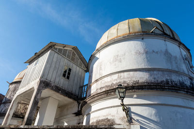 Low angle view of building against blue sky