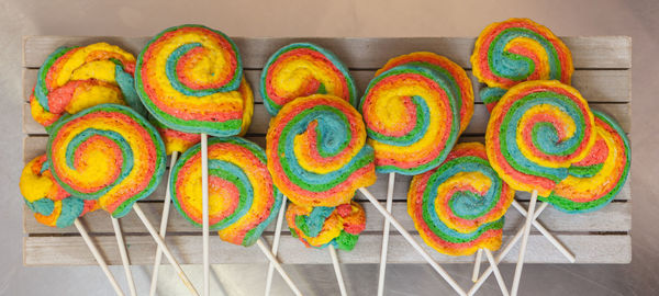 Pinwheels lollypop for carnival. colored shortbread cakes.