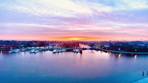 Scenic view of river against sky during sunset