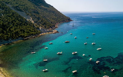 High angle view of boats on sea shore