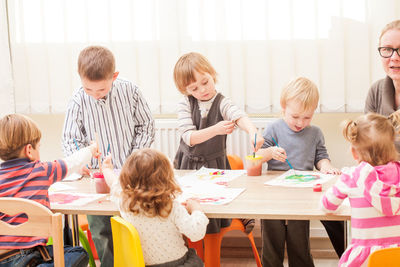 Group of people sitting in the table