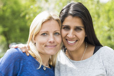 Portrait of affectionate lesbian couple at park