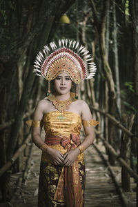 Woman wearing hat standing outdoors