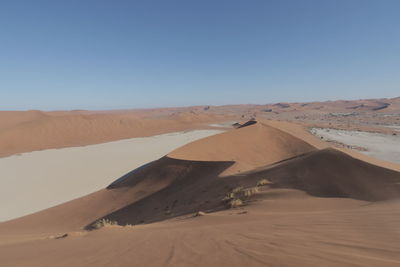 Scenic view of desert against clear sky