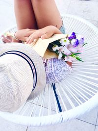 Low section of woman sitting on floor