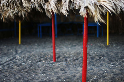 Close-up of red roof on field against building