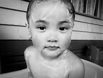 Close-up portrait of shirtless girl bathing