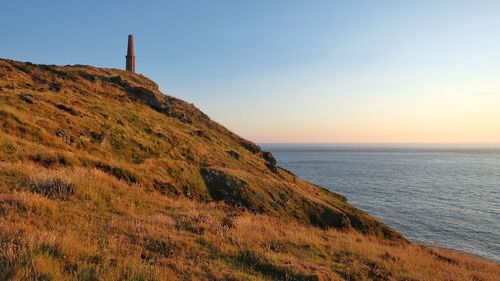 Scenic view of sea against clear sky during sunset