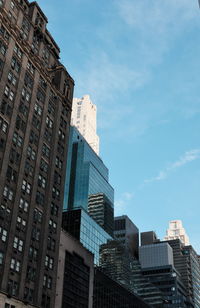 Low angle view of buildings against sky in city