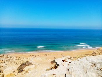 Scenic view of sea against clear blue sky