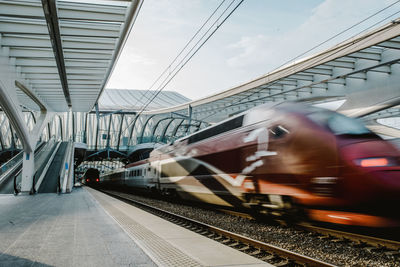 Train on railroad station platform against sky