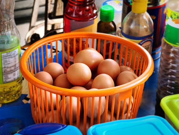 Close-up of eggs in basket for sale at market stall