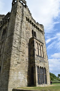 Low angle view of old building against sky