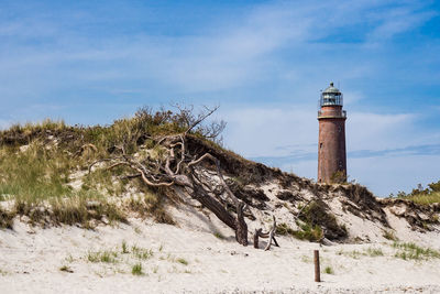 View of lighthouse against cloudy sky