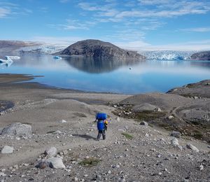 Rear view of man in glacier camp 