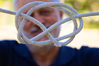 Close-up portrait of man against blurred background