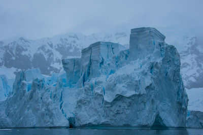 Scenic view of frozen sea against sky