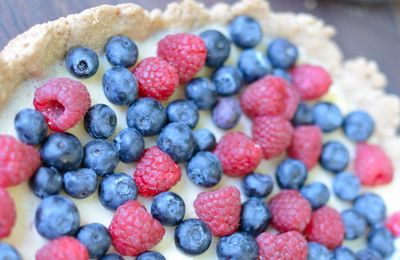 Close-up of raspberries and blueberries on tart