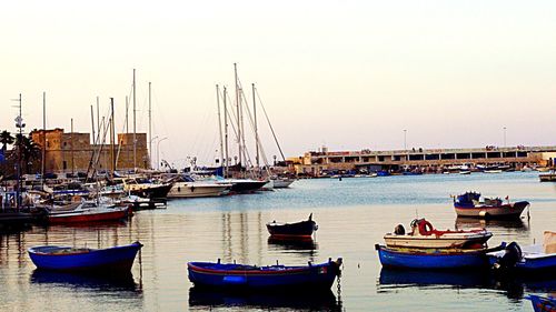 Boats moored at harbor