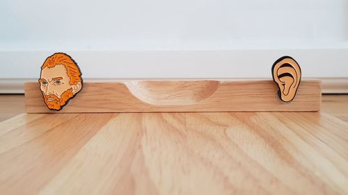 Close-up of information sign on hardwood floor