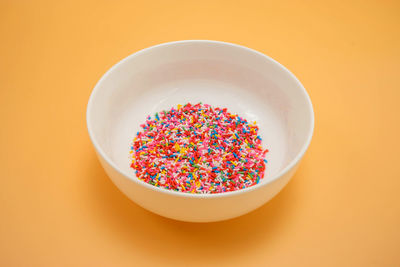 High angle view of multi colored candies on table