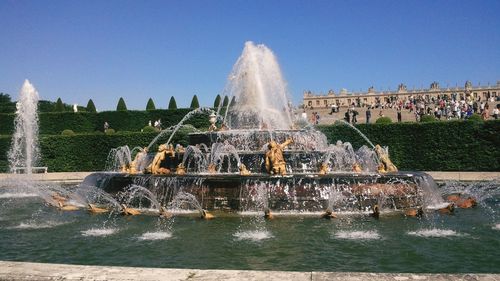 Fountain in park against sky