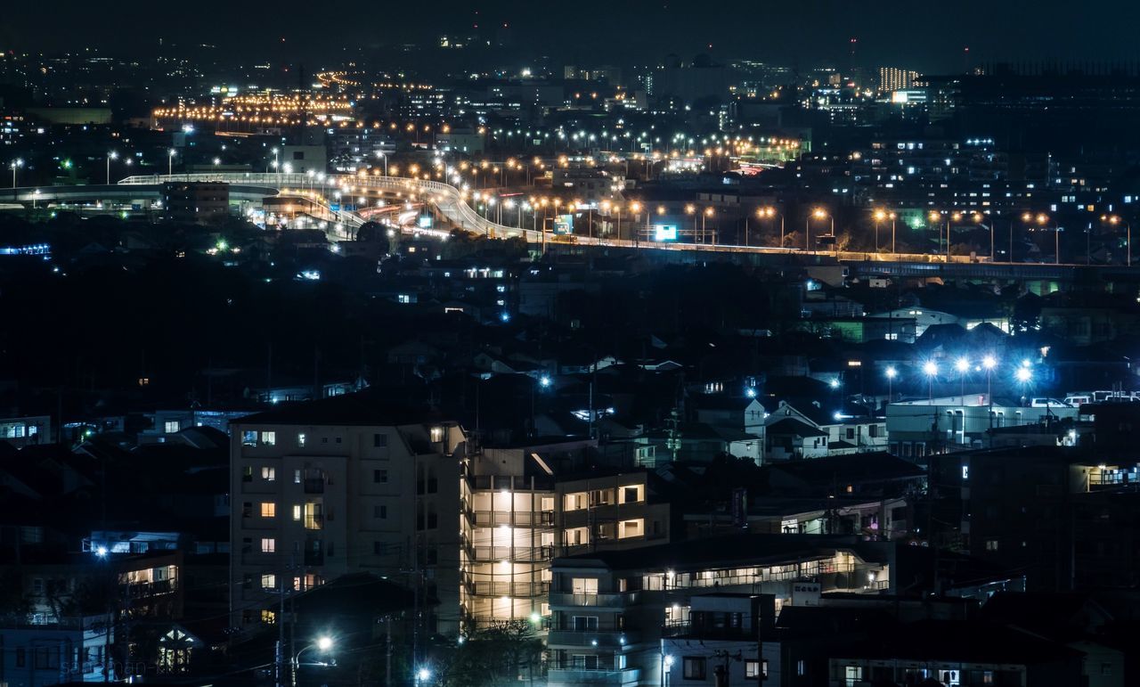 building exterior, city, night, architecture, cityscape, illuminated, built structure, building, high angle view, no people, residential district, glowing, outdoors, city life, modern, nature, office building exterior, skyscraper, settlement, nightlife, financial district