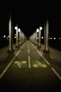 Close-up of illuminated road at night