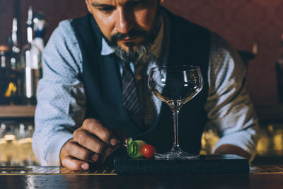 Bartender preparing cocktail in bar