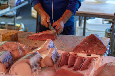 Midsection of man preparing food