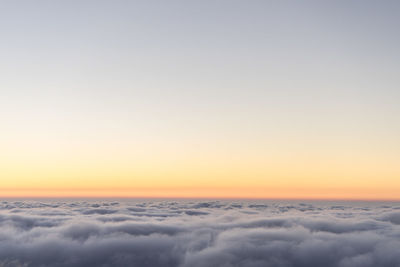 Scenic view of snow against sky during sunset