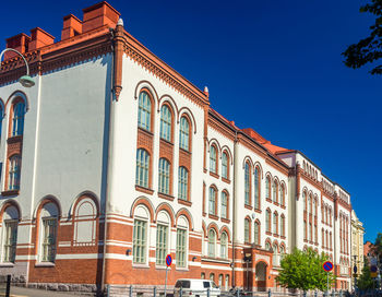 Low angle view of building against blue sky